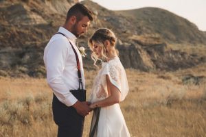 Romantic And Moody Wedding Inspiration Bride And Groom Hold Hands