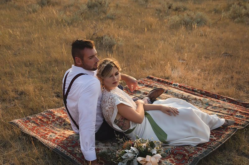Romantic And Moody Wedding Inspiration Bride And Groom Sit On Rug