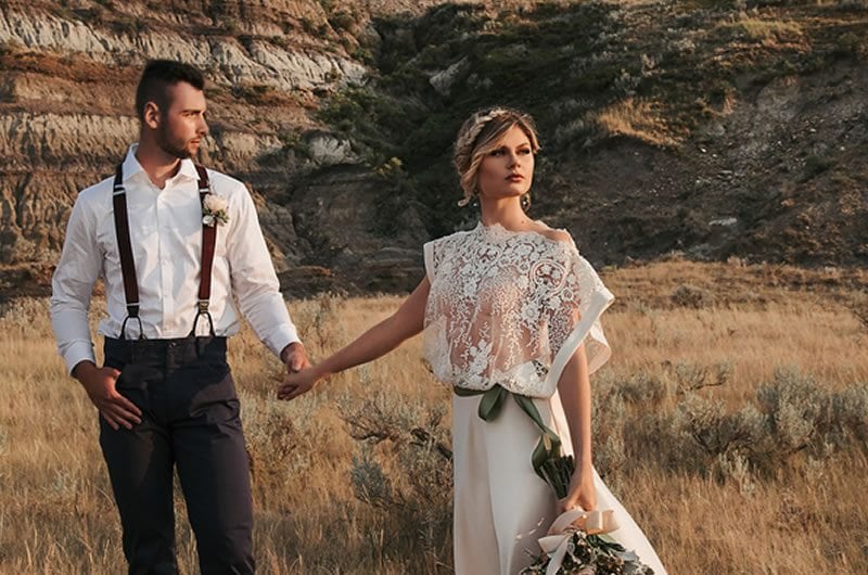 Romantic And Moody Wedding Inspiration Bride And Groom Walking With Bouquet