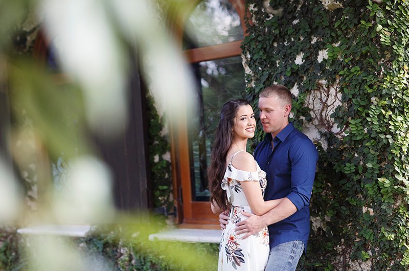 Cozy Country Engagement Session Couple Against Wall