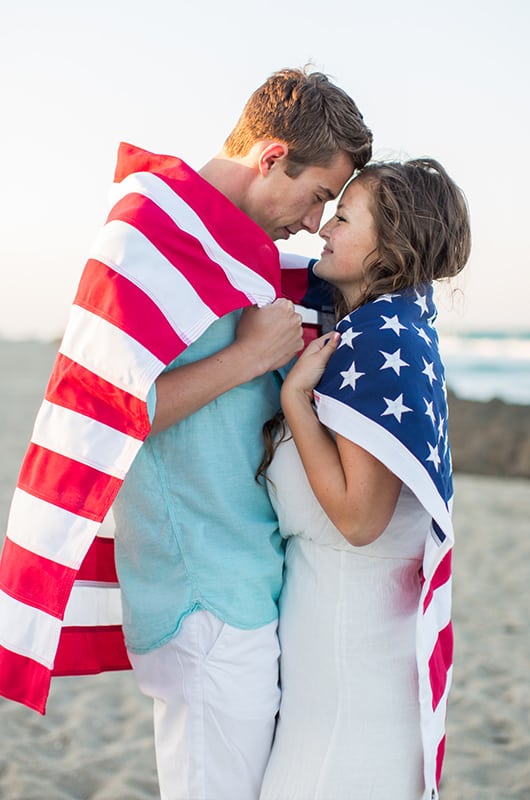 Patriotic Engagment Shoot Wrapped In Flag Hug