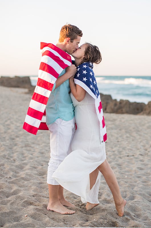 Patriotic Engagment Shoot Wrapped In Flag Kiss