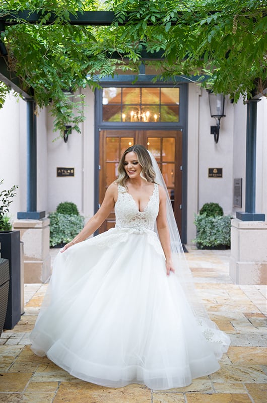 Casey Holmes Getting Ready Holding Dress