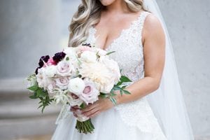 Casey Holmes Getting Ready Holding Flowers