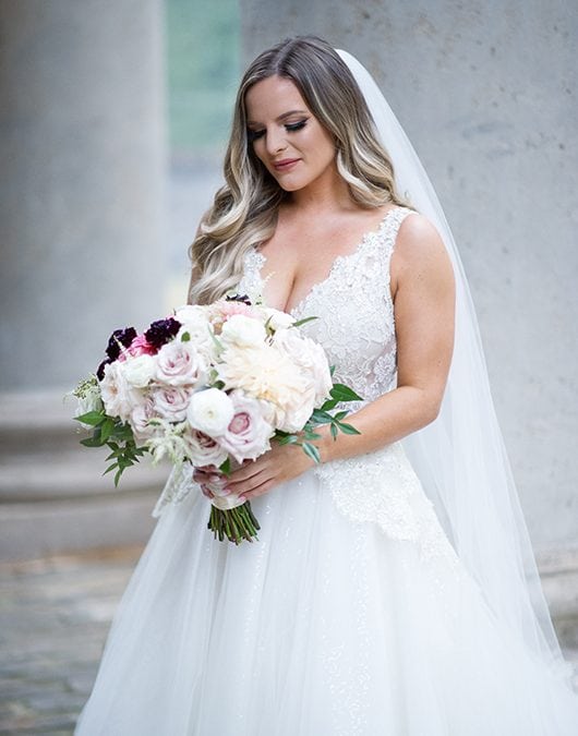 Casey Holmes Getting Ready Holding Flowers