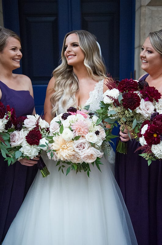 Casey Holmes Reception Smiling With Flowers