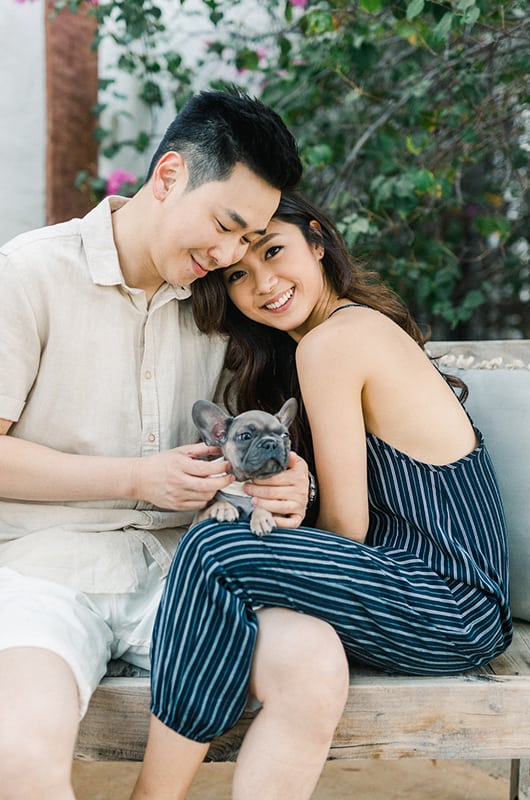 Kim Ye Engagement Portrait Leaning On HOlding Dog