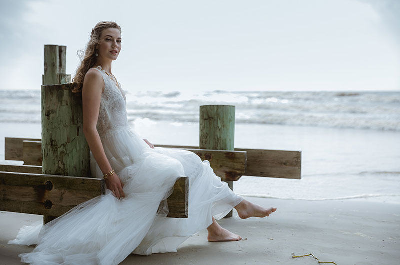 Layered Chiffon Mora Dress By Elisabetta Polignano Sitting On Beach