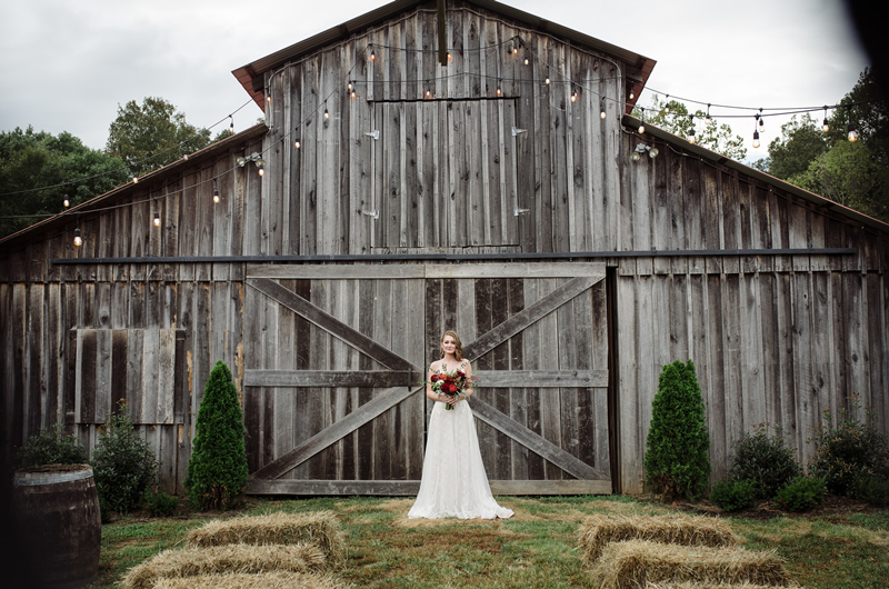 Barn Wedding With An Urban Chic Twist Invitation Bride In Front Of Barn