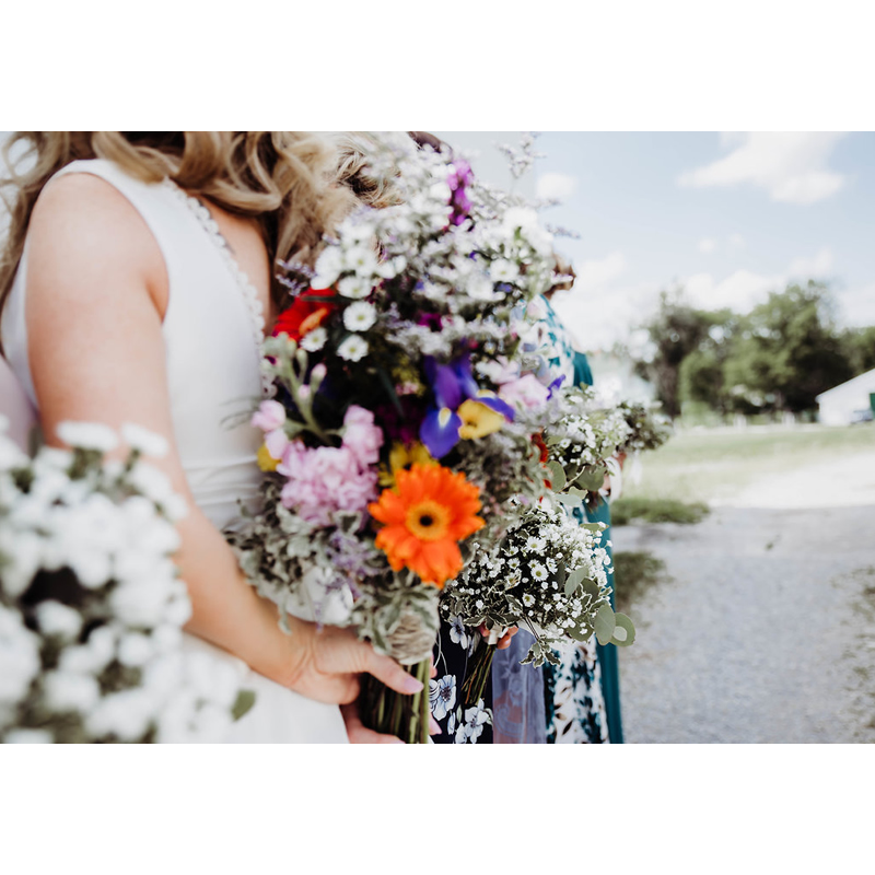 Amanda Cocanougher and Tyler Williamson Lookbook Colorful Wildflowers Bouquet Behind Back