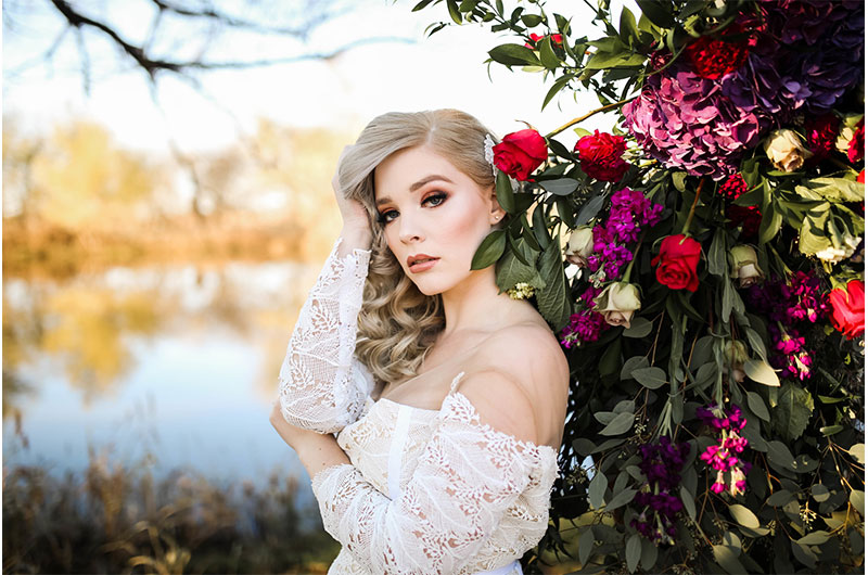 Woodsy Jewel Toned Shoot Bride With Arbor Closeup