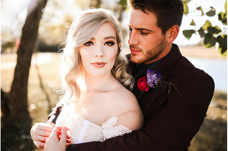 Woodsy Jewel Toned Shoot Closeup Couple Looking At Camera