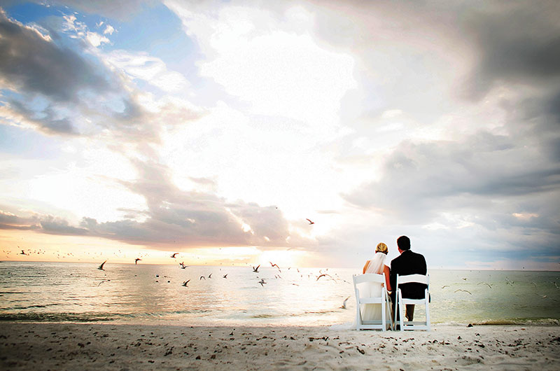 Marco Beach Ocean Resort, Marco Island, Florida Married Couple Sitting On The Beach