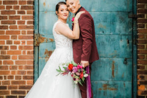 A Merry & Bright Winter Wedding Shoot Couple Both Looking At Camera