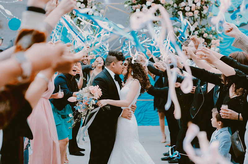 The Big Fake Wedding Nashville Couple Kissing With Streamers