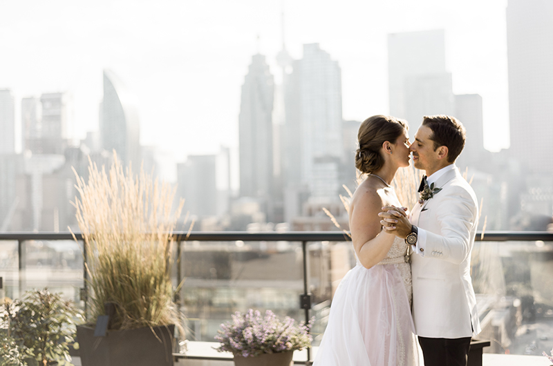 Just Married In Toronto Couple Kiss On Balcony