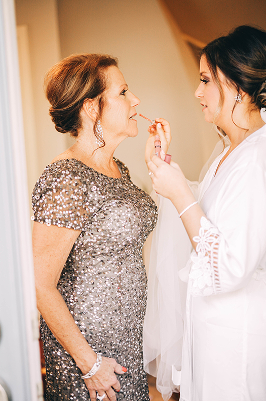 Happy Mothers Day Bride Putting Lipgloss On Mom