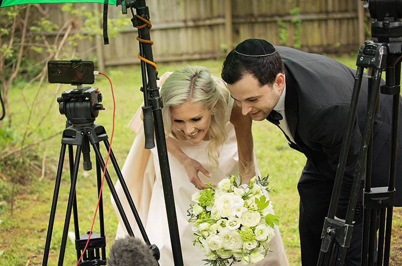 Memphis Chef Josh Steiner & Marketing Director Wallis Tosi’s Virtual At Home “I Do” Is Beyond Adorable Couple Looking At Pictures (1) Memphis Chef Josh Steiner & Marketing Director Wallis Tosi’s Virtual At Home “I Do” Is Beyond Adorable Couple Looking At Pictures (1)
