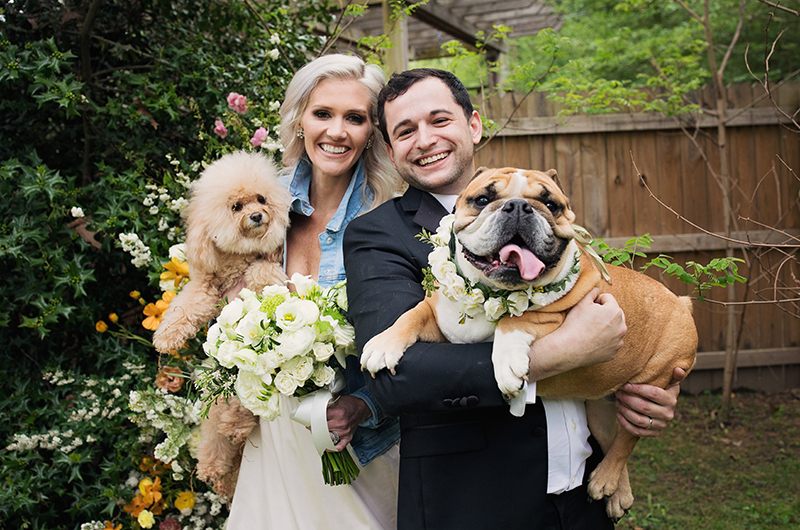 Wallis And Josh Couple Holding Dogs