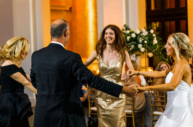 Celebrating National Parents Day Mother And Father Of Bride Holding Hands Walking Down The Aisle