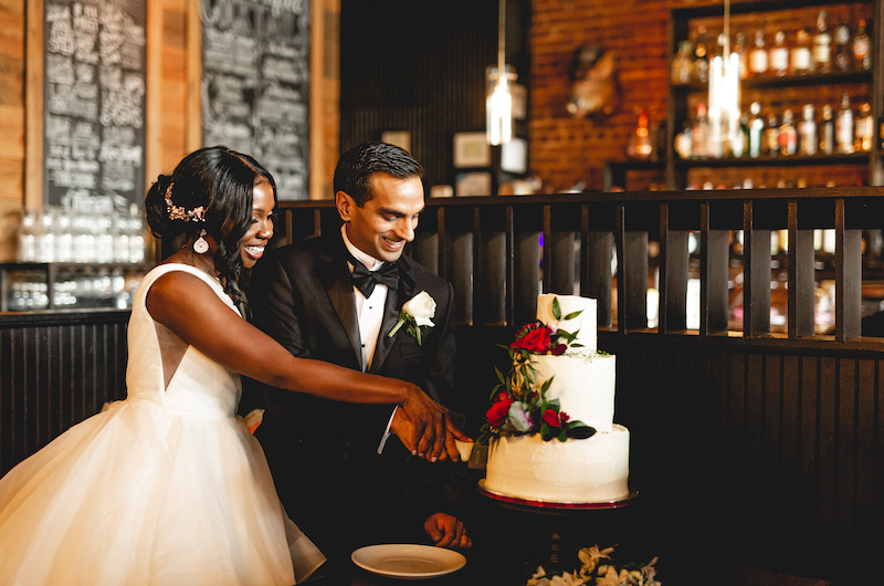 Natasha And Nikeshs Multicultural Courthouse Ceremony In Georgia Bride And Groom Cutting The Cake Natasha And Nikeshs Multicultural Courthouse Ceremony In Georgia Bride And Groom Cutting The Cake