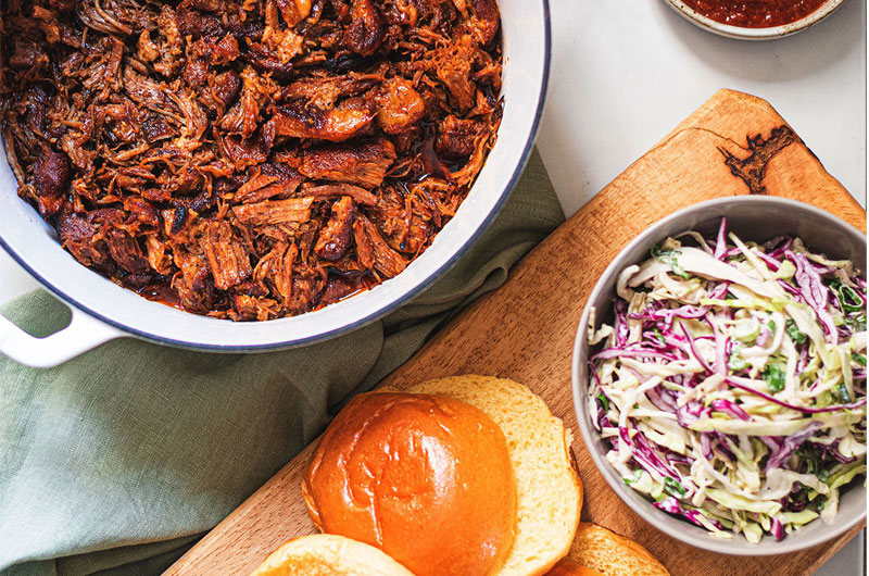 Why This Range Of Cookware By Kana Should Be On Your Registry Pulled Pork Dutch Oven Table Spread