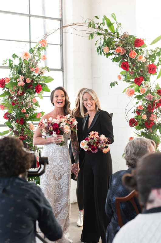Propcellar Was The Perfect Backdrop For This Vintage Memphis Wedding Brides Standing Under Arch Propcellar Was The Perfect Backdrop For This Vintage Memphis Wedding Brides Standing Under Arch