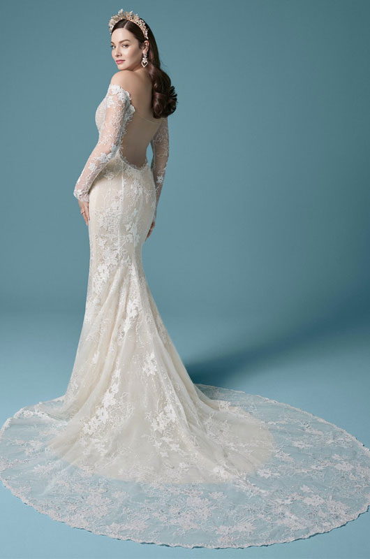 Leading Bridal Boutique Ivory And Beau Shares Wedding Gown Trends For 2021 Model Looking Over Shoulder