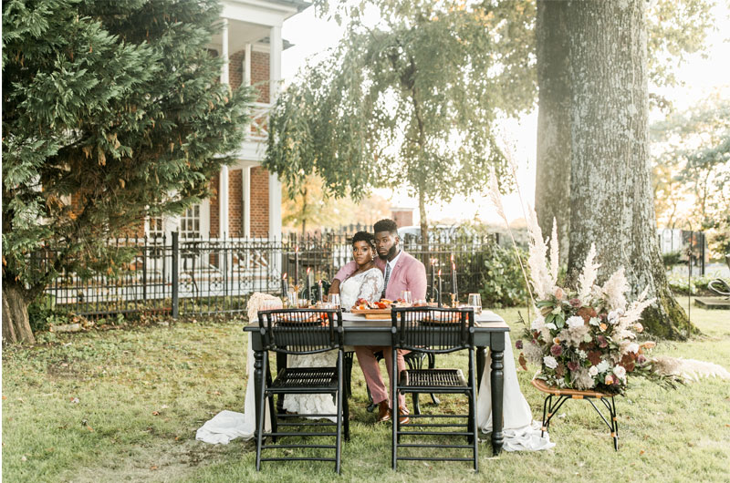 Memphis Metal Museum Styled Wedding Features Fall Boho Vibes Bride And Groom Sitting At Table