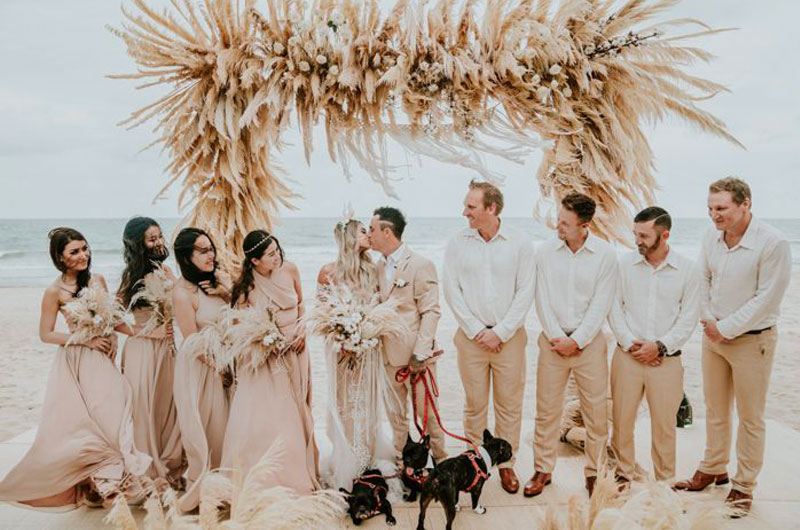 Revamp Your Seasonal Beach Wedding With Dried Floral Accents Wedding Party Under Dried Floral Structure
