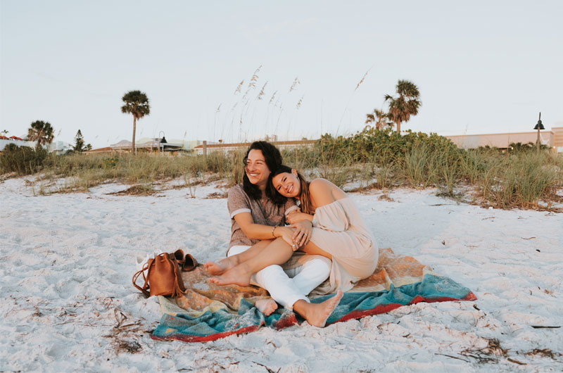 St Petersburg Florida Staycation Ends In Blissful Beachside Proposal Couple Hugging On Beach