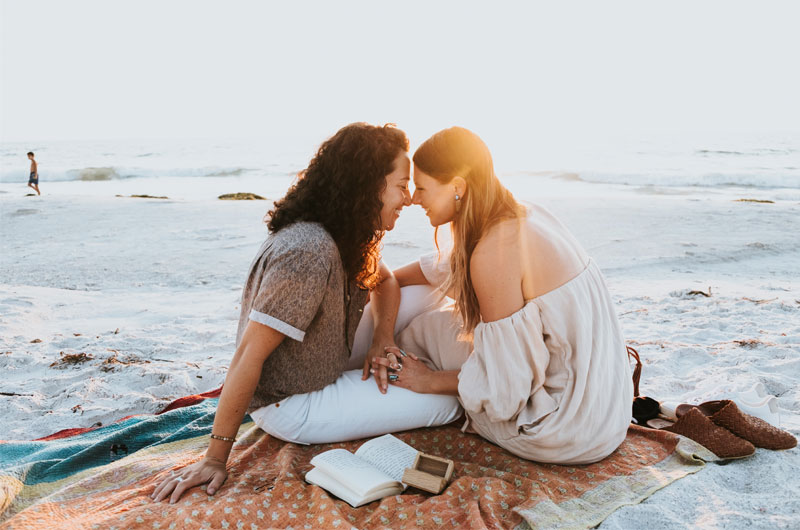 St Petersburg Florida Staycation Ends In Blissful Beachside Proposal Holding Hands And Smiling