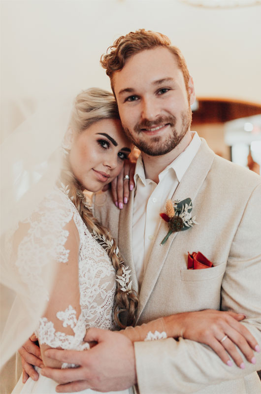 Styled Shoot Showcases A Fall, Rustic Indoor Wedding Venue Couple Shot