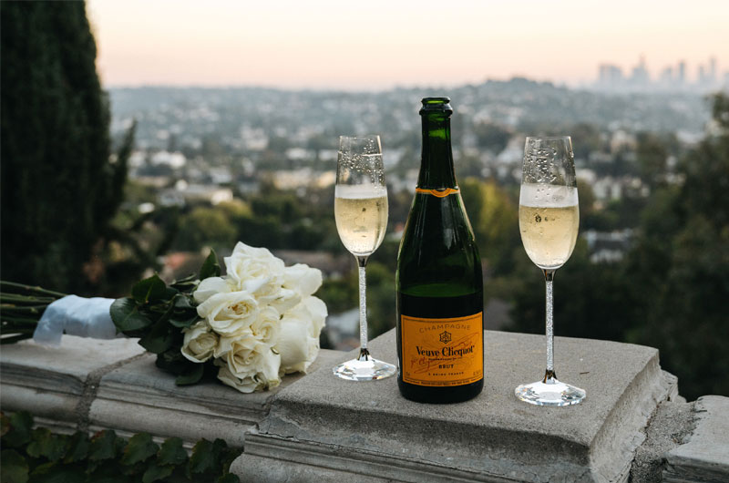 Celebrity Couple Alex Hall And Brianna Hugans Glamorous California Elopement Champagne Bottle