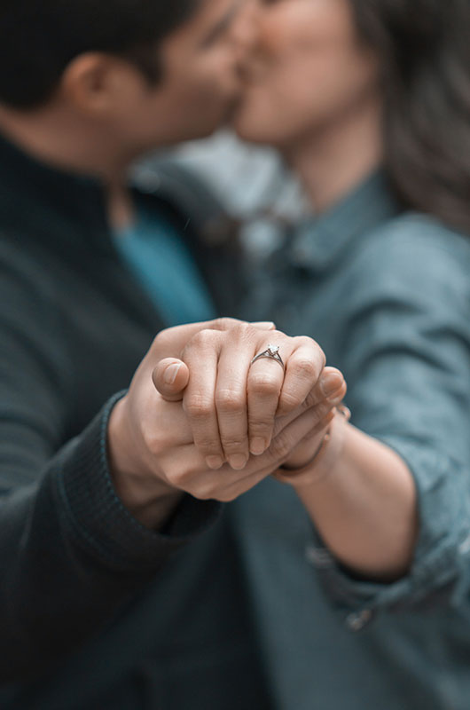 How Much You Should Spend On An Engagement Ring Couple Kissing With Ring How Much You Should Spend On An Engagement Ring Couple Kissing With Ring