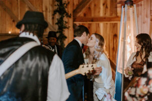 Kathryn And McLean Palmer’s Barn Wedding At The Old School Nashville Bride Kissing Groom On The Cheek