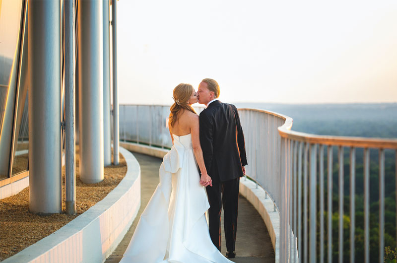 Patti And Chad Hagwoods Elegant Wedding At The Club In Birmingham Alabama Couple Kissing On The Balcony