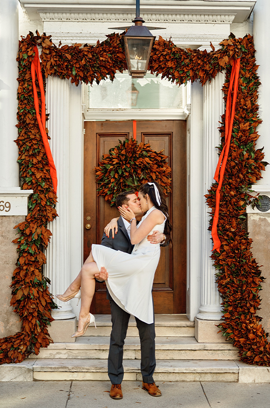 South Carolina Couple Postpones Big Wedding For A Christmas Elopement Groom Picking Up Bride And Kissing Her