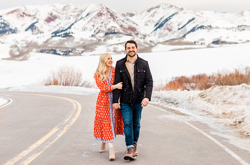 Callie And Kyle’s Colorado Mountainside Engagement Couple Walking Down The Road