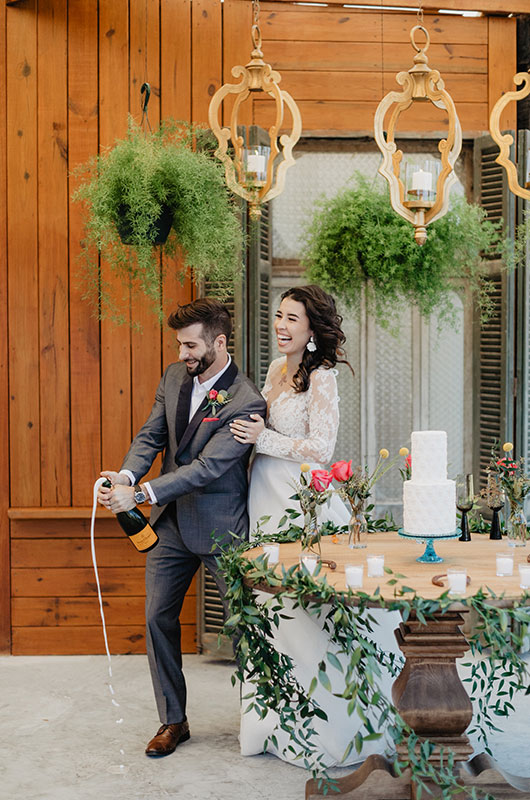 Argentine Polo Inspired Wedding At Garrett Field Estancia In Louisiana Couple Popping Champagne