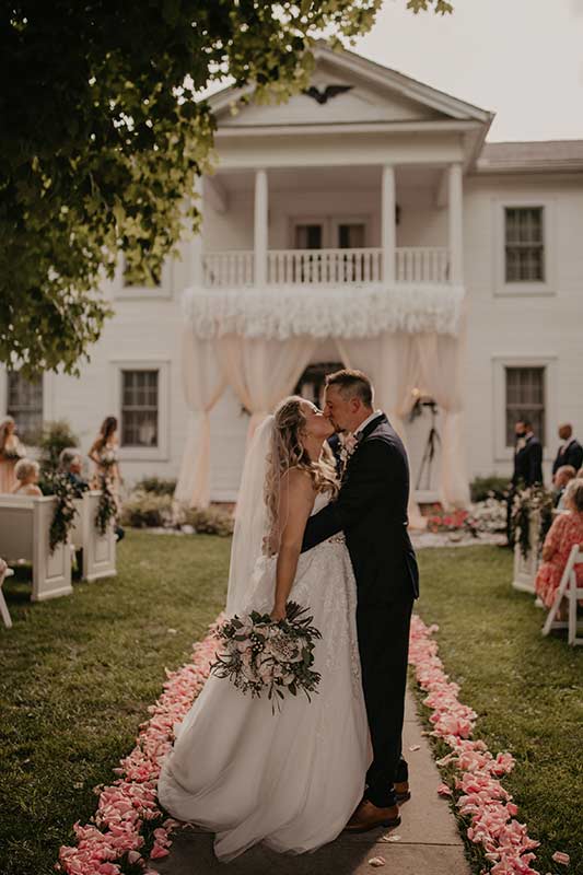Bethany And Dakota Caudill Celebrate An Outdoor Monticello Kentucky Wedding Bride & Groom Kiss