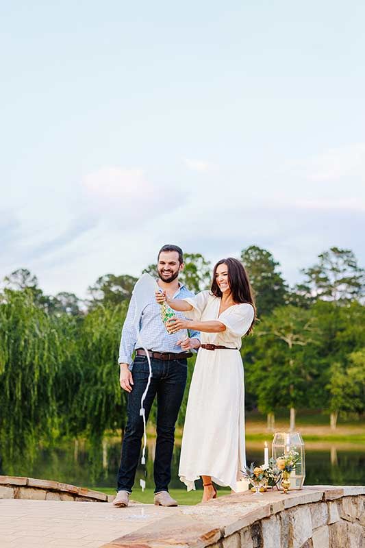 An Italian Garden Inspired Wedding At The Farm At High Shoals In Bishop, Georgia Popping Champagne An Italian Garden Inspired Wedding At The Farm At High Shoals In Bishop, Georgia Popping Champagne