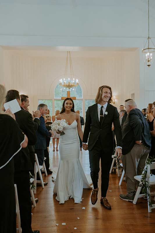 Marissa Mowry And Trevor Lawrence Wedding In South Carolina Bride And Groom Walking Down The Aisle