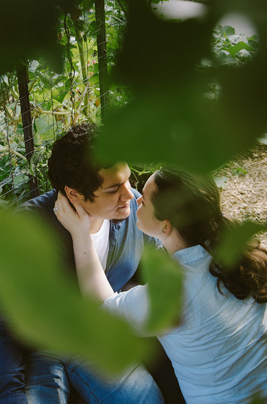 An Engagement At The Memphis Botanical Gardens Through Trees