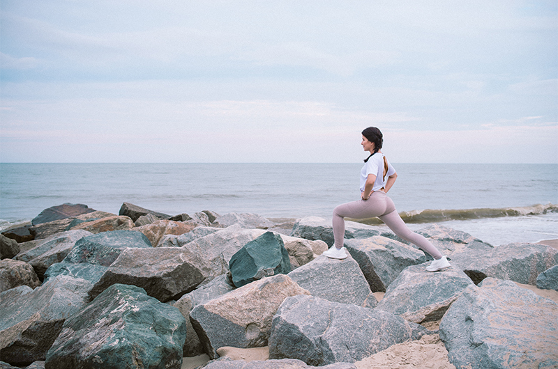 Six Self Care Strategies To Feel Your Bridal Best For Your Big Day Woman Stretching On Rocks Outside Copy