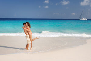 You Cant Figure Out What Type Of Honeymoon Couple You Are Couple Hugging On Beach Copy