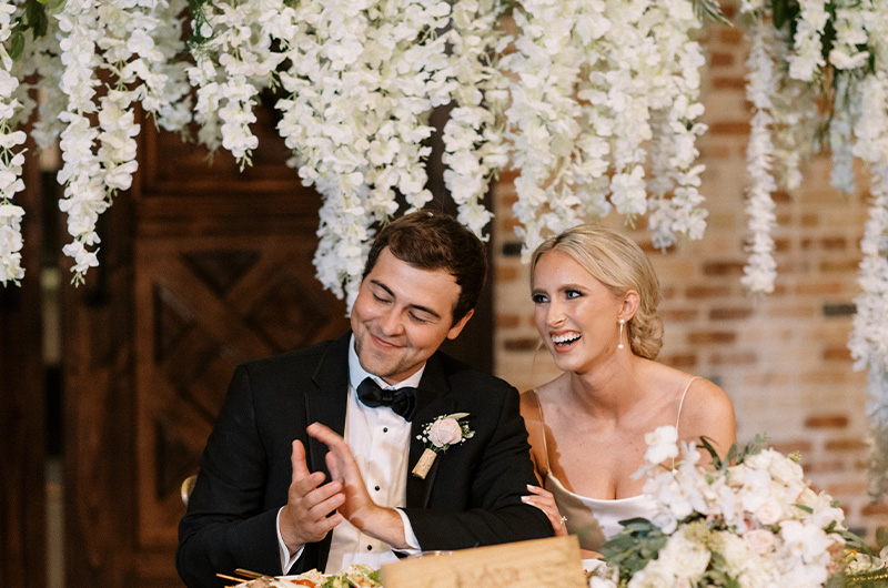 Carly Brown And J Paul Madison Marry At A Timeless Bryan Texas Vineyard Bride And Groom At The Reception Table