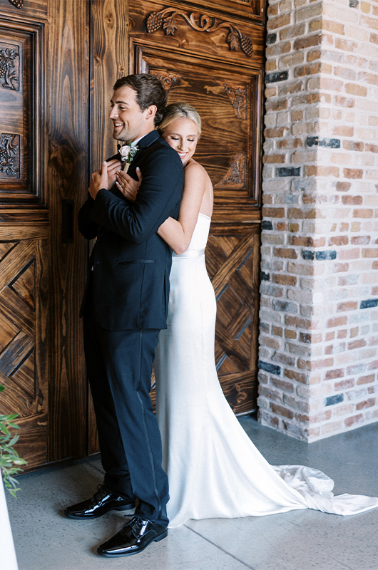 Carly Brown And J Paul Madison Marry At A Timeless Bryan Texas Vineyard Bride And Groom First Look