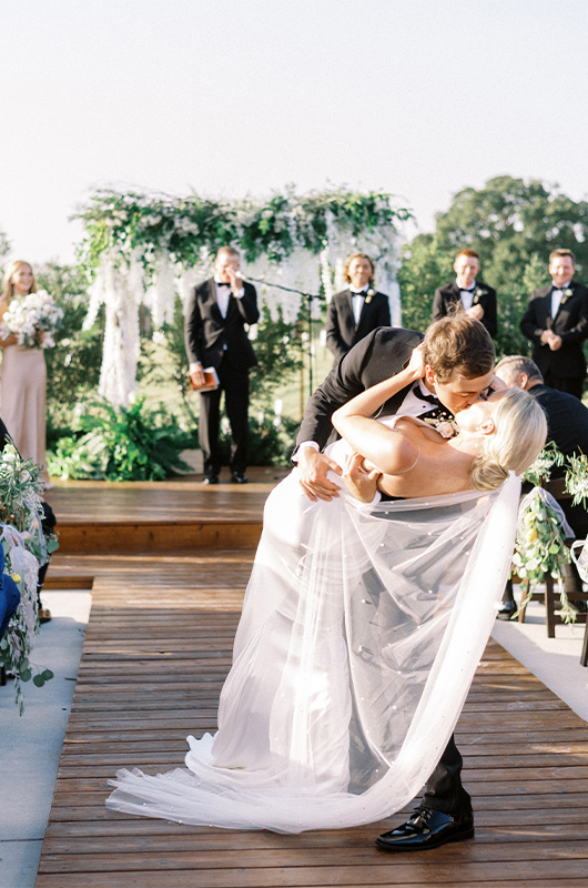 Carly Brown And J Paul Madison Marry At A Timeless Bryan Texas Vineyard Bride And Groom Kissing