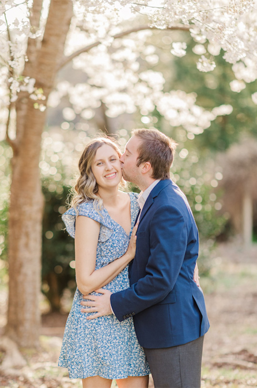 Kristin And Hunters Romantic Cherry Blossom Engagement Groom Kisses Bride Closeup Copy